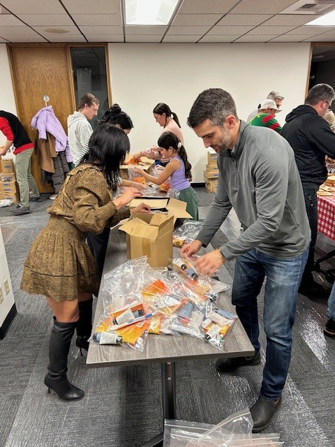 Volunteers packing hygiene kits for Seattle Union Gospel Mission